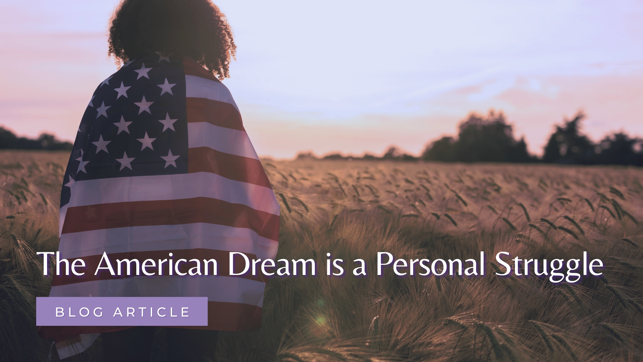 Woman with an American flag over her shoulders and standing ina field