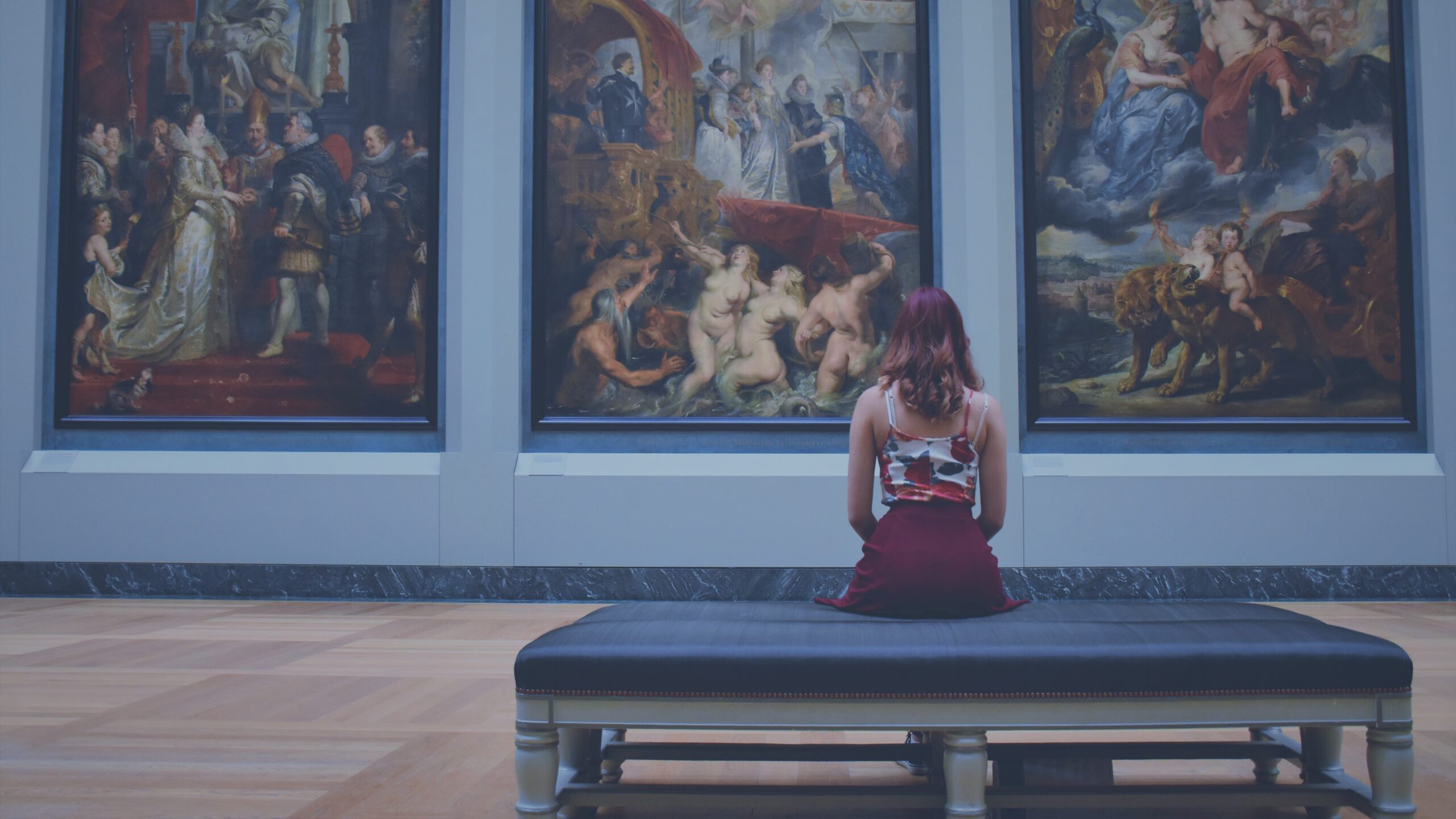 Woman sitting in an art museum