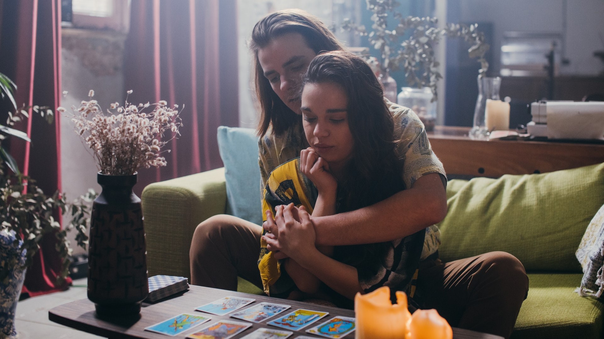 Couple reading their tarot cards together