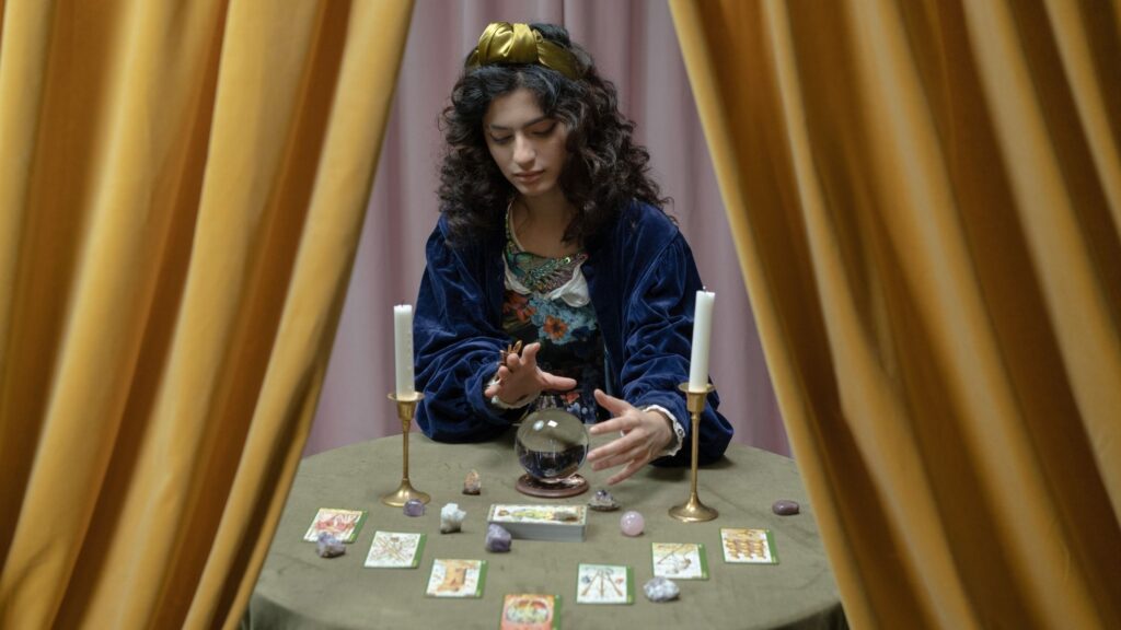 Woman channeling a spirit in front of tarot cards