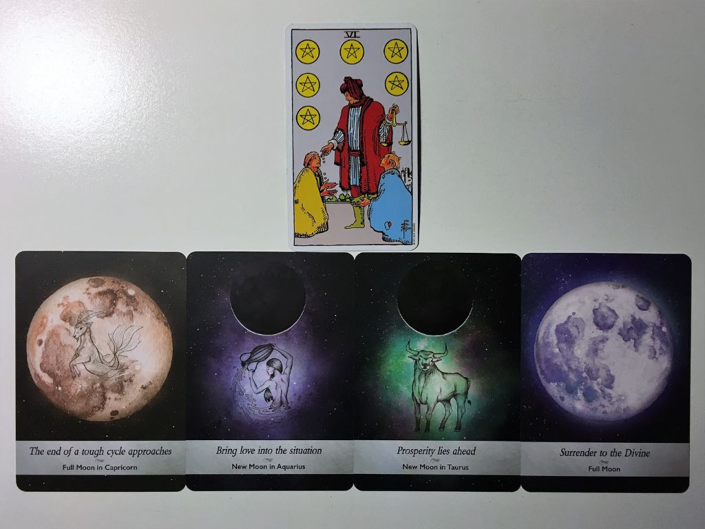 Tarot card and four oracle cards