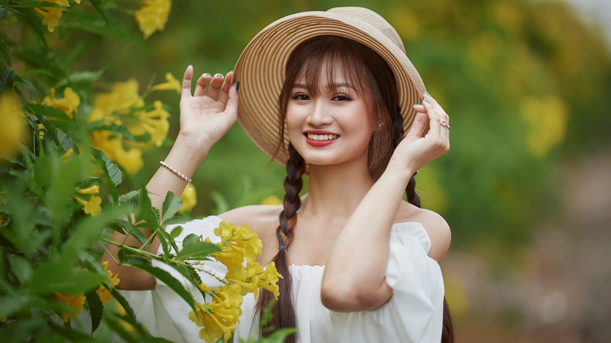 Woman in a sun hat in a garden