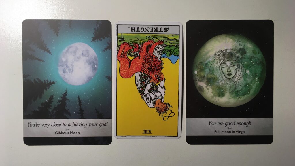 Tarot card and two oracle cards