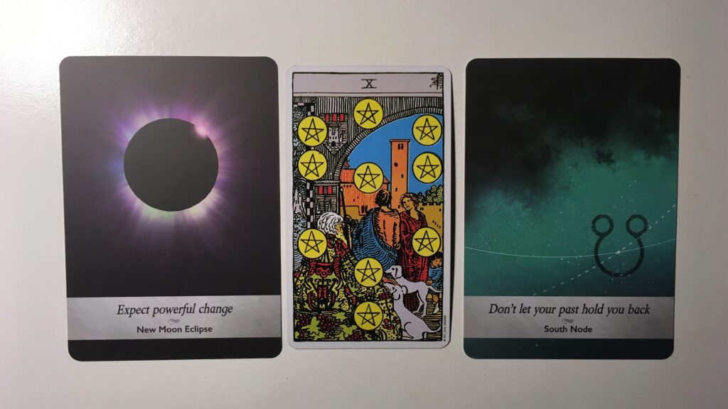 A tarot card and two oracle cards