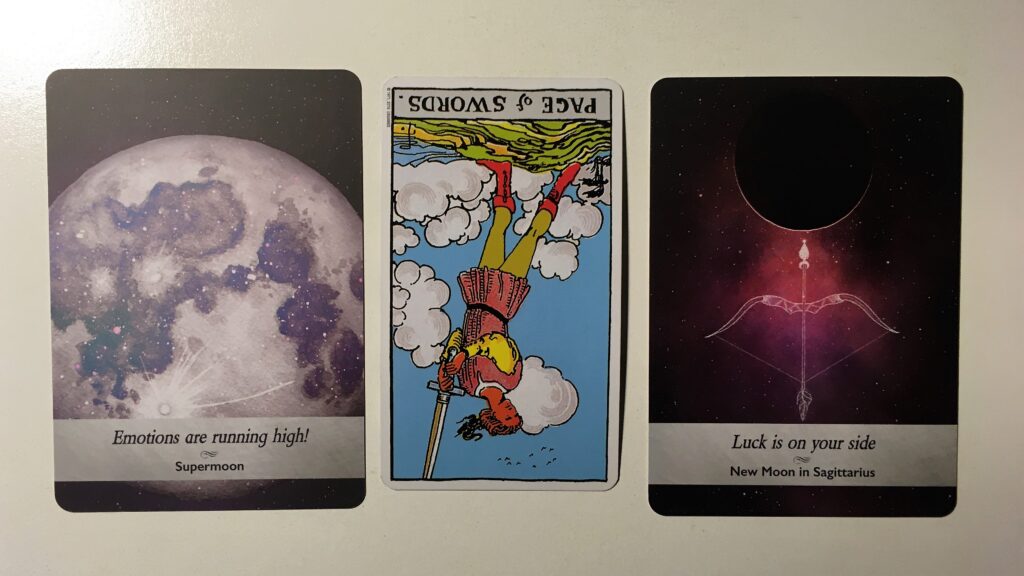 Tarot card and two oracle cards