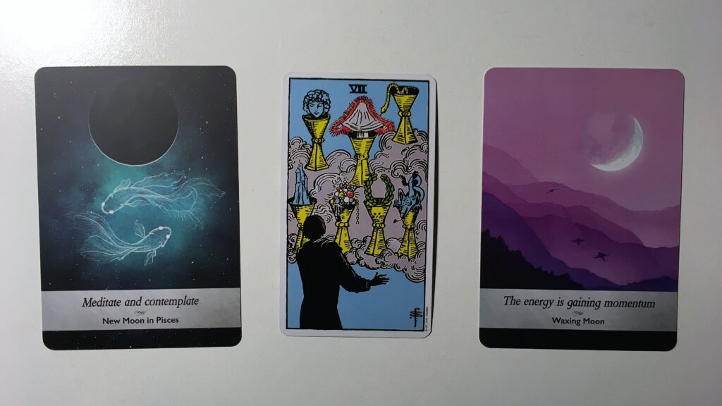 Tarot card and two oracle cards