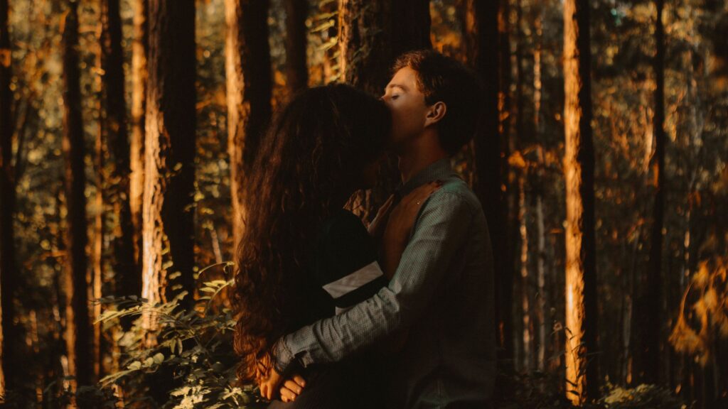 Couple embracing in the woods