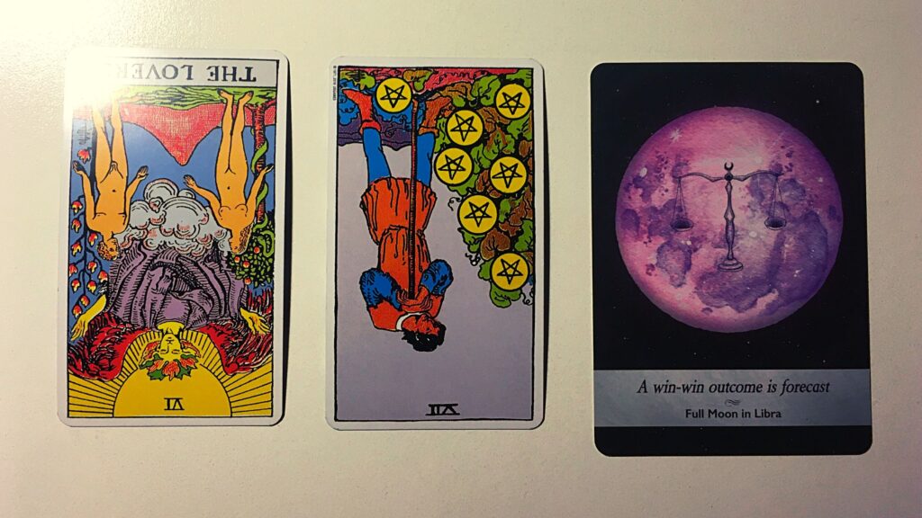 Two tarot cards and an oracle card