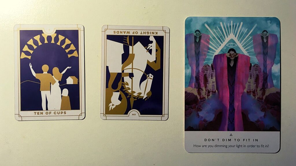 Two tarot cards and an oracle card