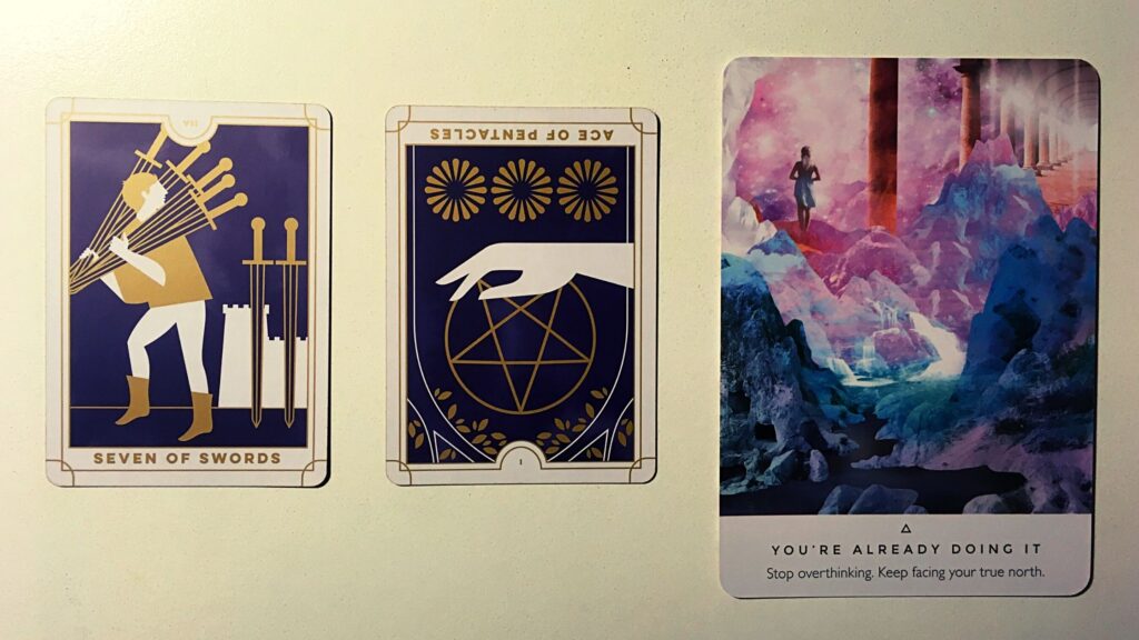 Two tarot cards and an oracle card