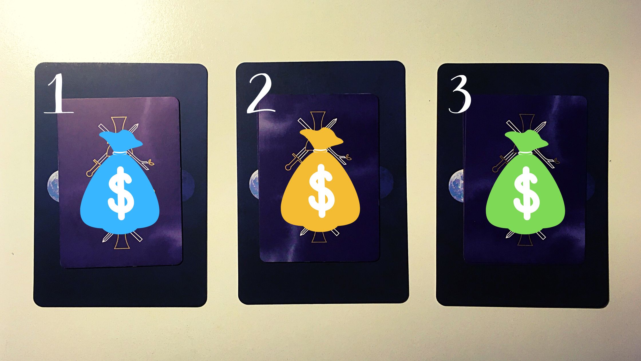 Three tarot pick a card piles with money bags on them