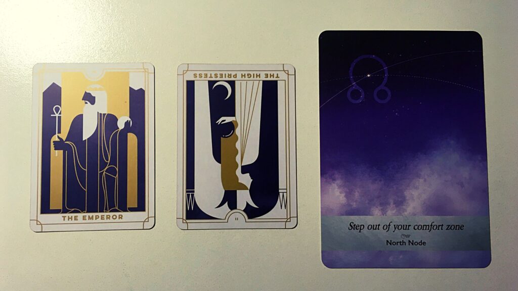 Two tarot cards and an oracle card