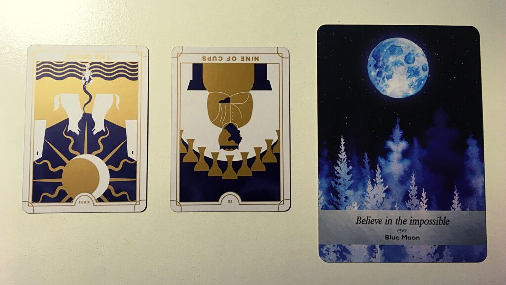 Two tarot cards and an oracle card