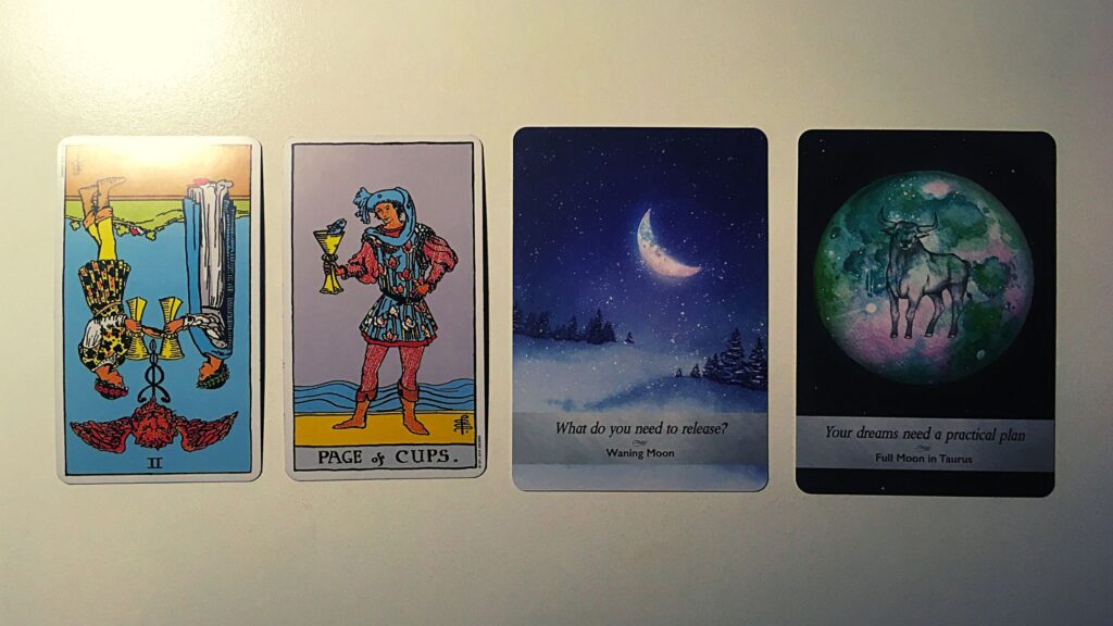 Two tarot cards and two oracle cards