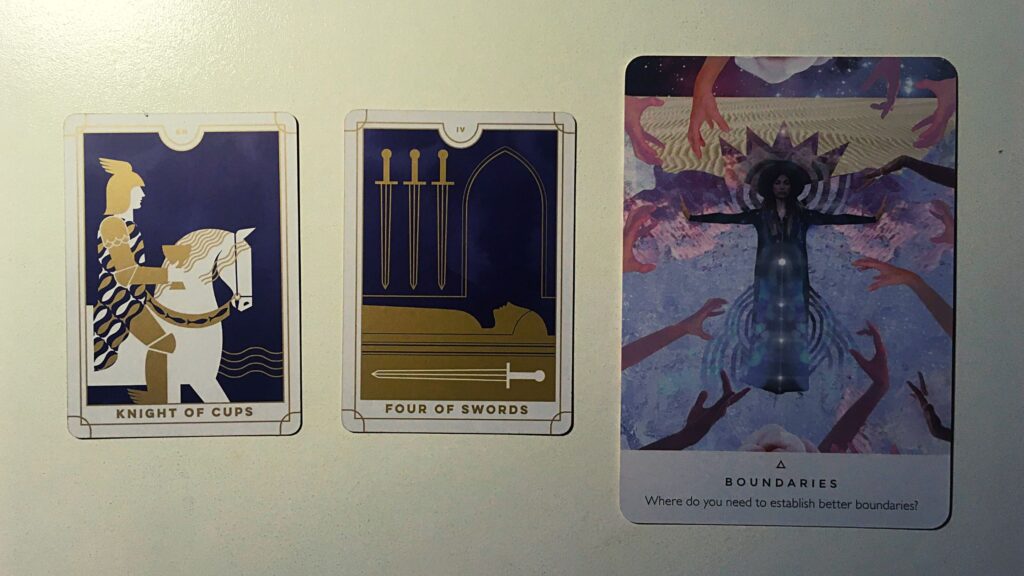 Two tarot cards and an oracle card