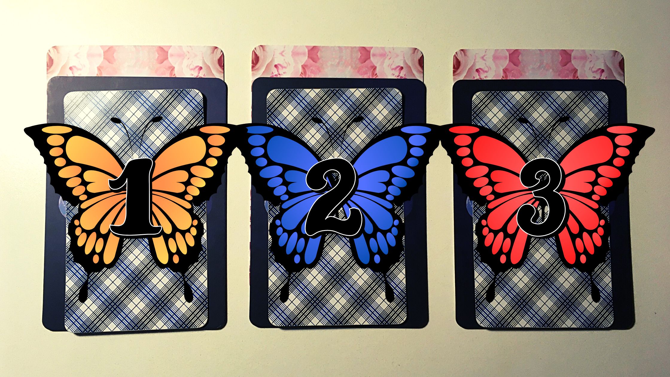 Three tarot and oracle pick a card piles with butterflies on them