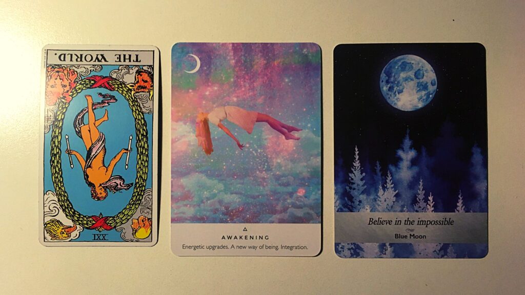 Tarot card and two oracle cards