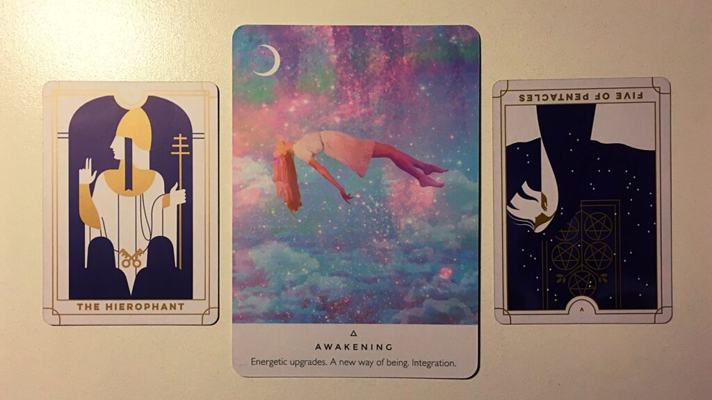 Two tarot cards and an oracle card