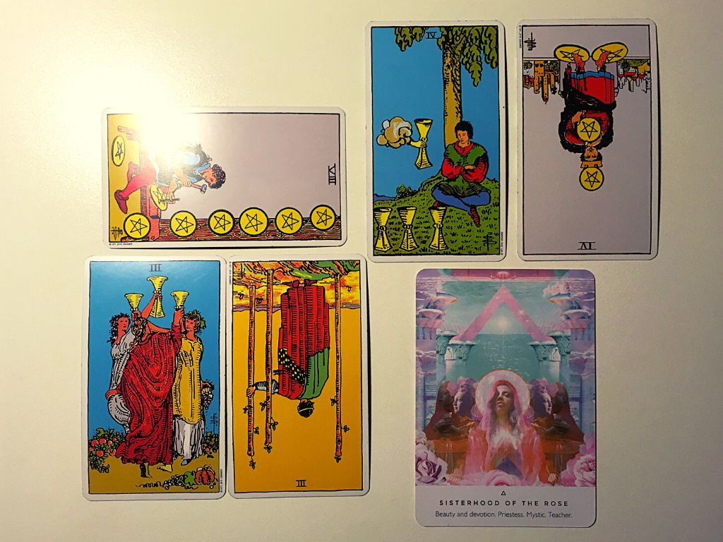 Five tarot cards and an oracle card