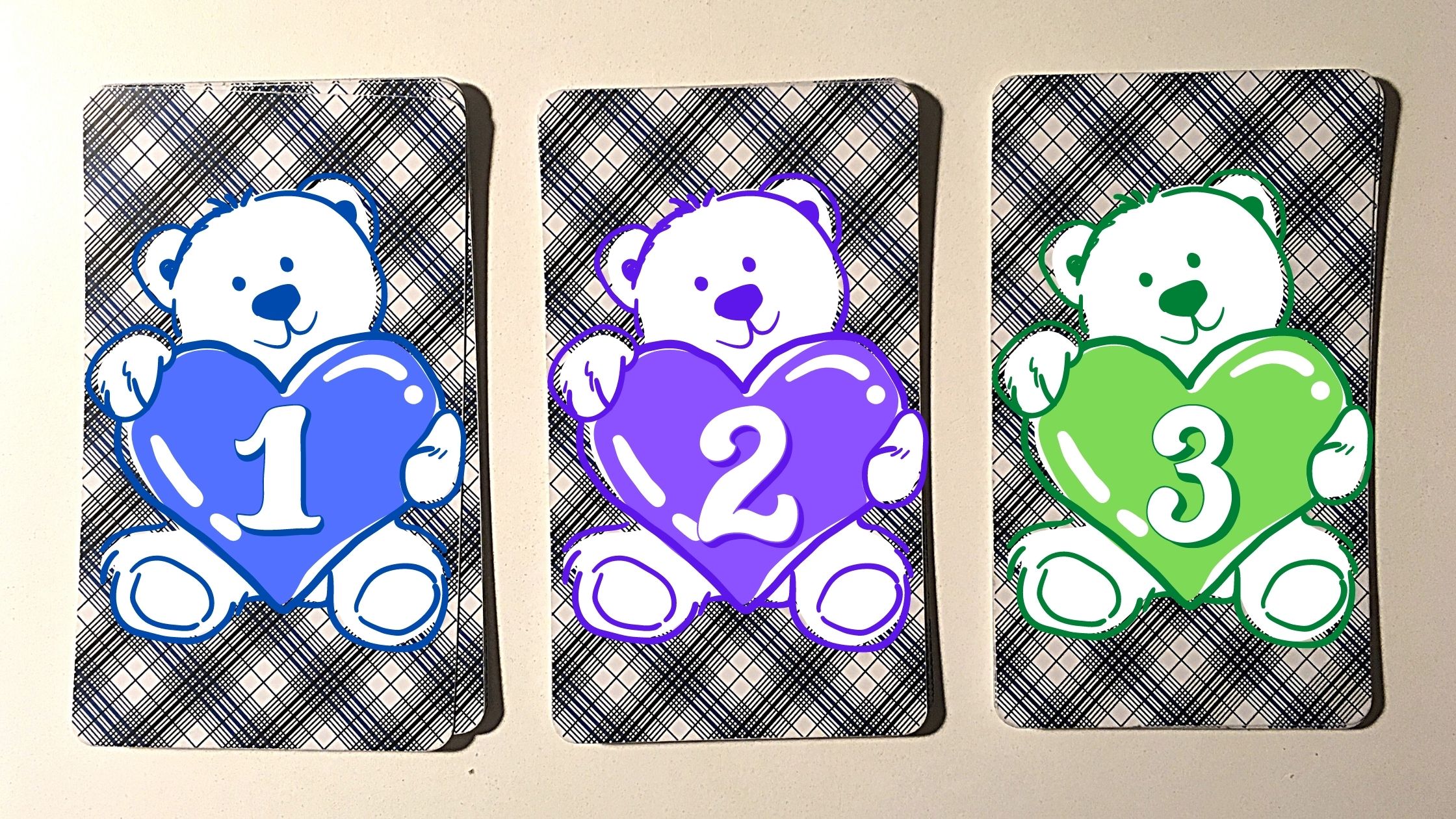 Three tarot pick a card piles with bears holding hearts on them