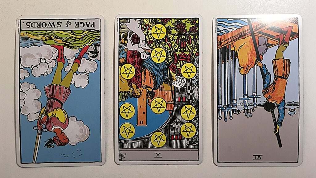 Three tarot piles from the Rider-Waite deck