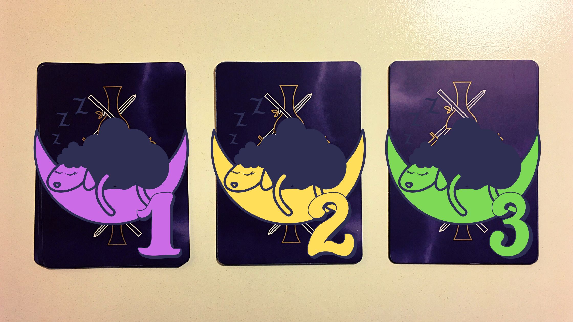 Three tarot pick a card piles with sheep on them