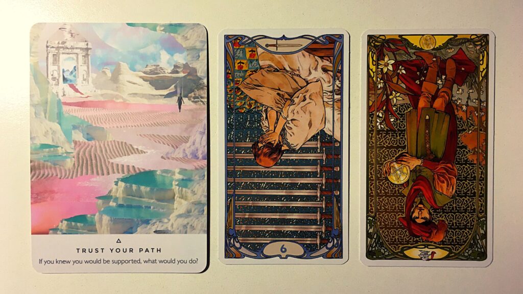 Oracle card and two tarot cards