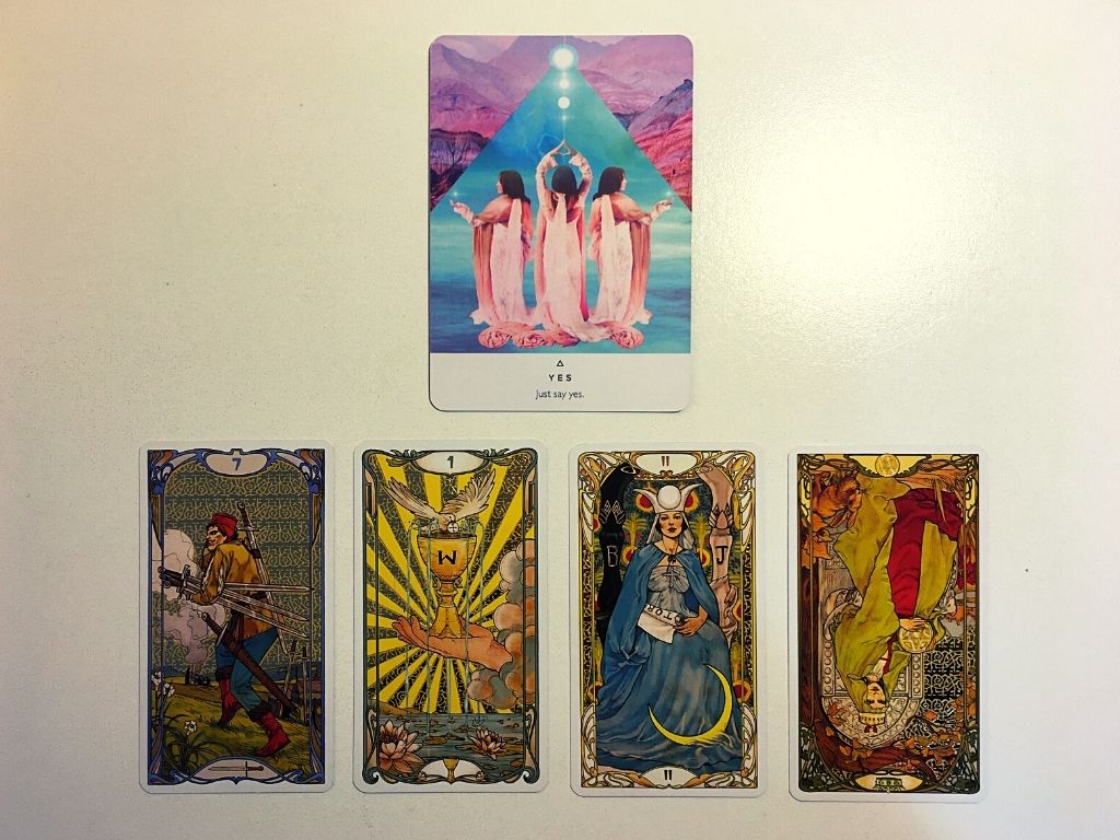 Oracle card and four tarot cards