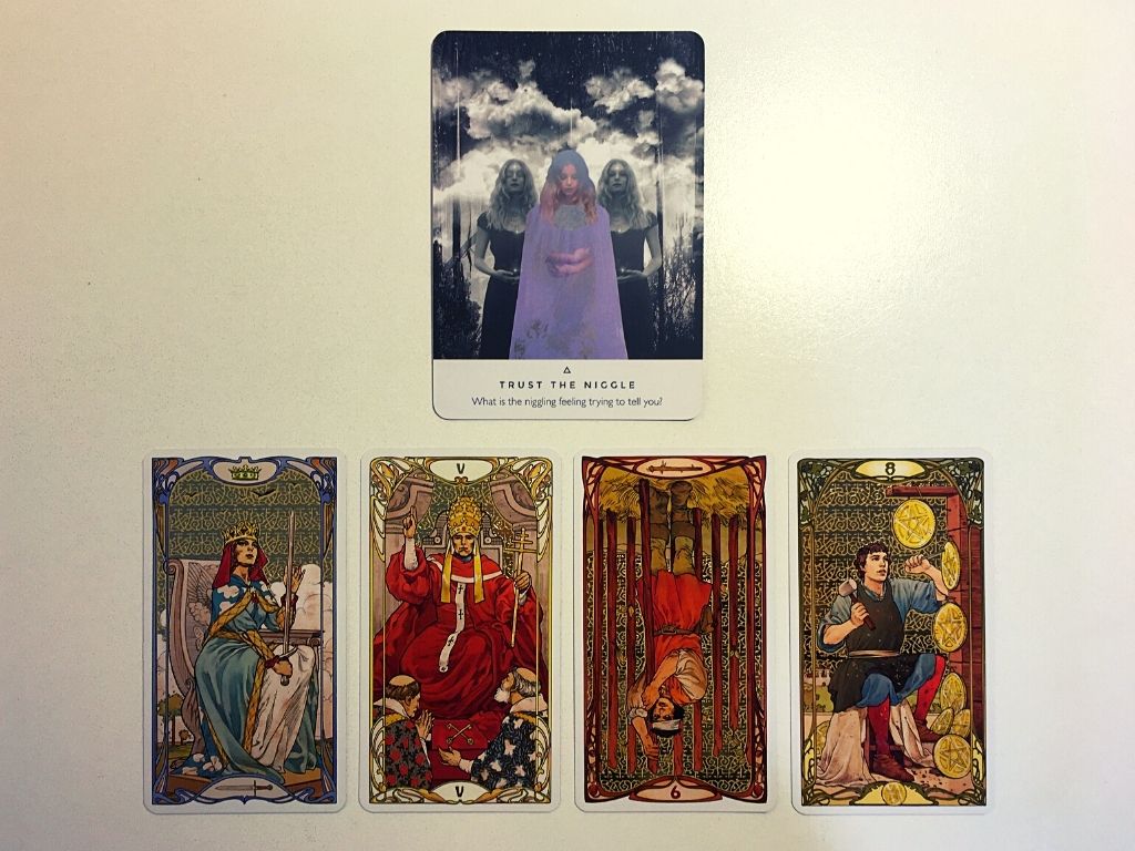 Oracle card and four tarot cards