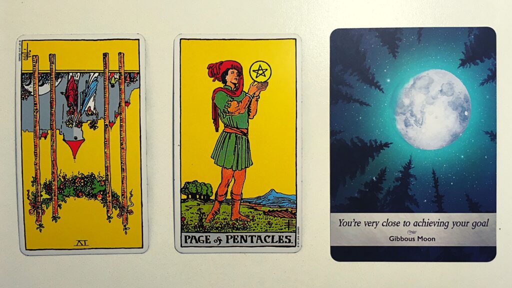 Two tarot cards and an oracle card