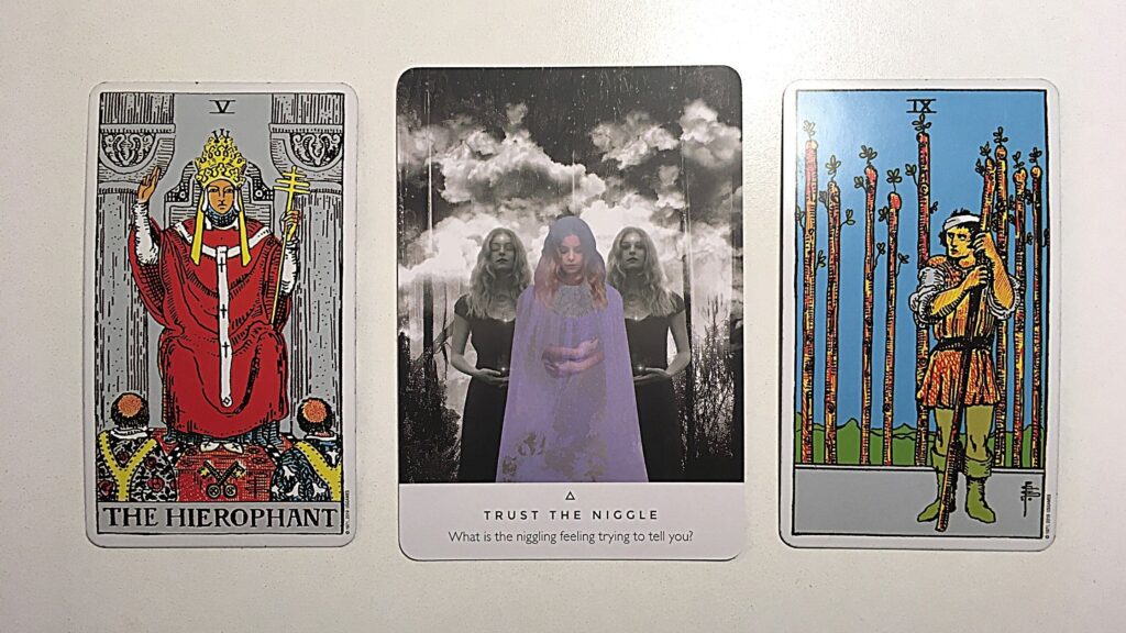 Oracle card and two tarot cards