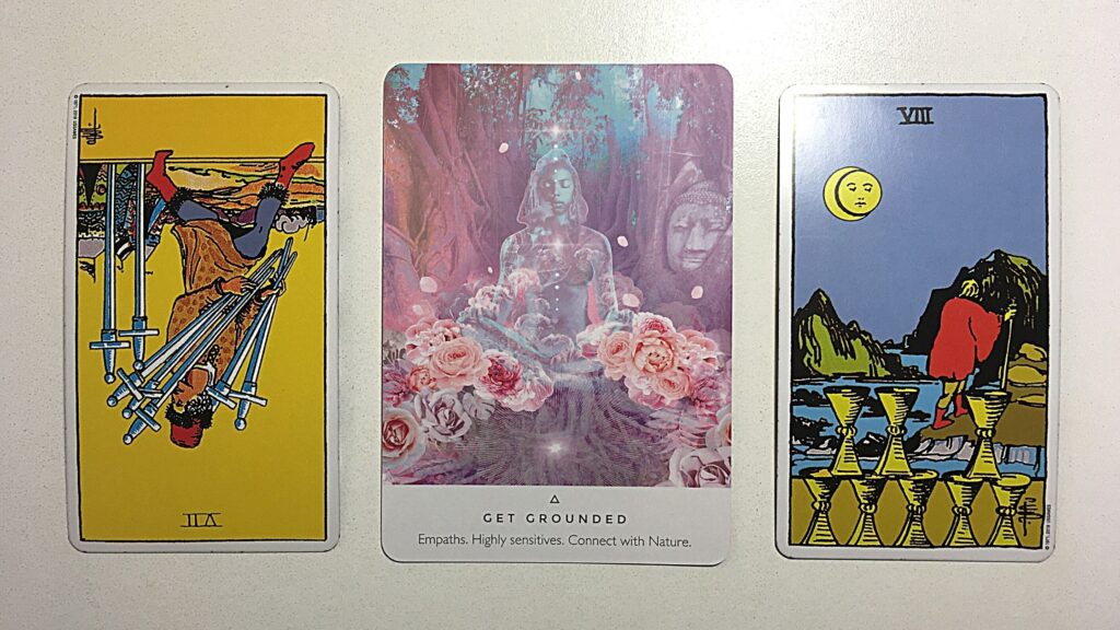 Oracle card and two tarot cards