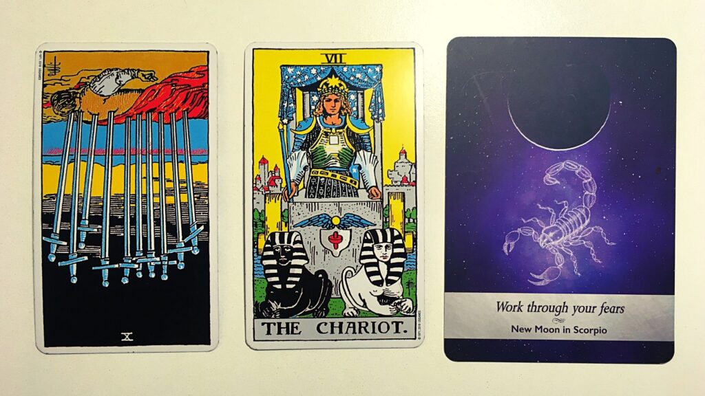 Two tarot cards and an oracle card