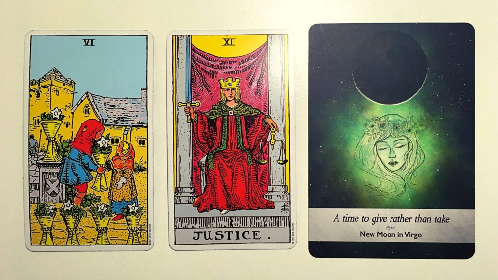 Two tarot cards and an oracle card