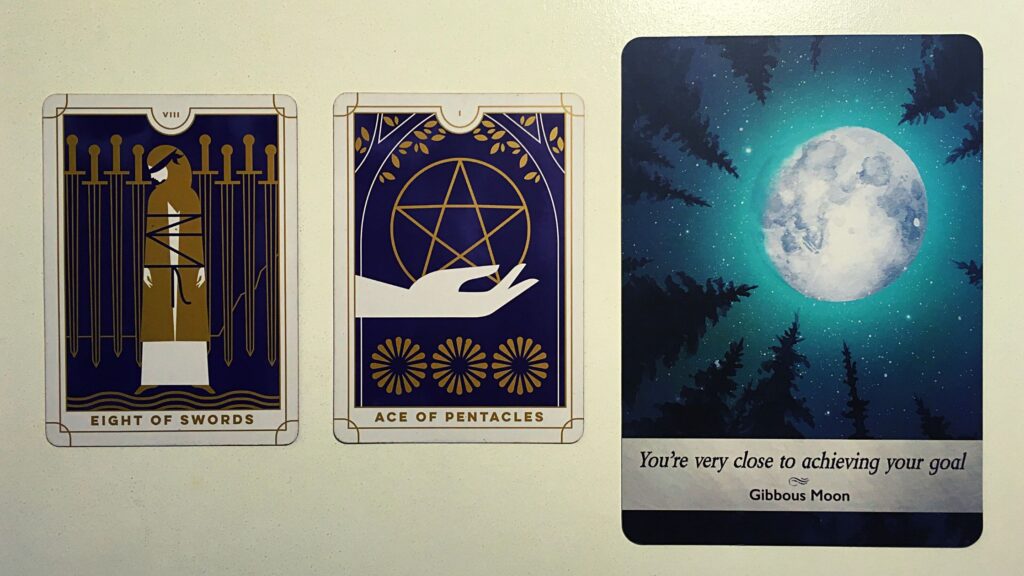 Two tarot cards and an oracle card