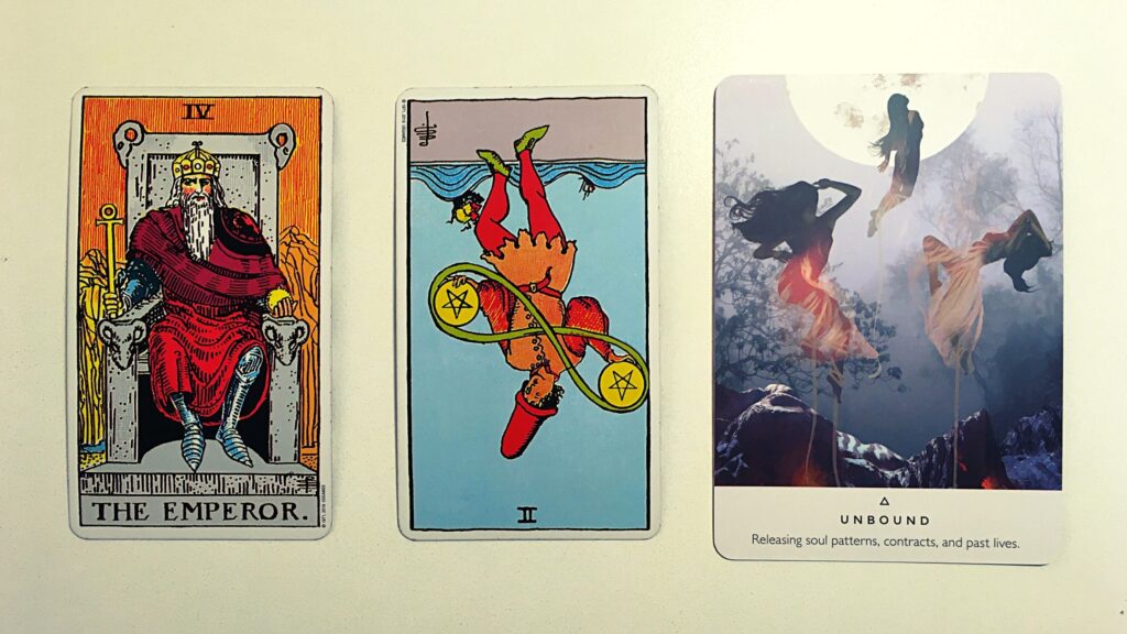 Two tarot cards and an oracle card