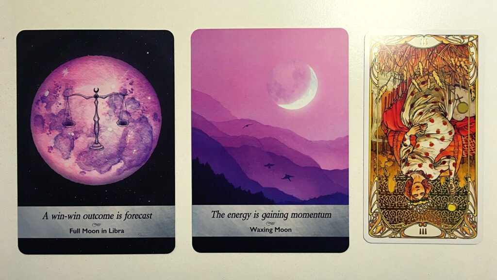 Two oracle cards and a tarot card