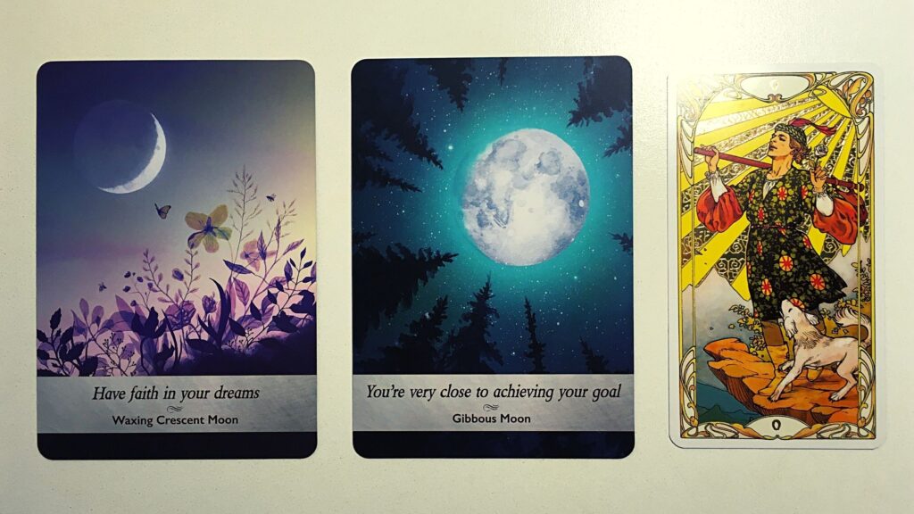 Two oracle cards and a tarot card