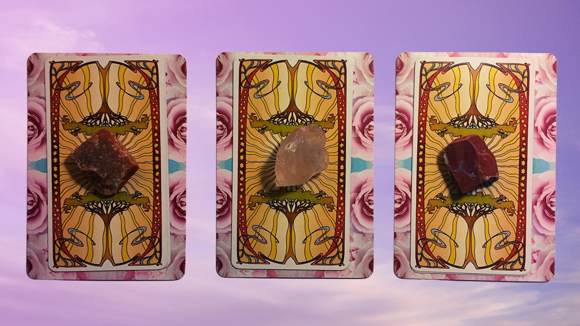 Three tarot and oracle pick a card piles with gemstones on them