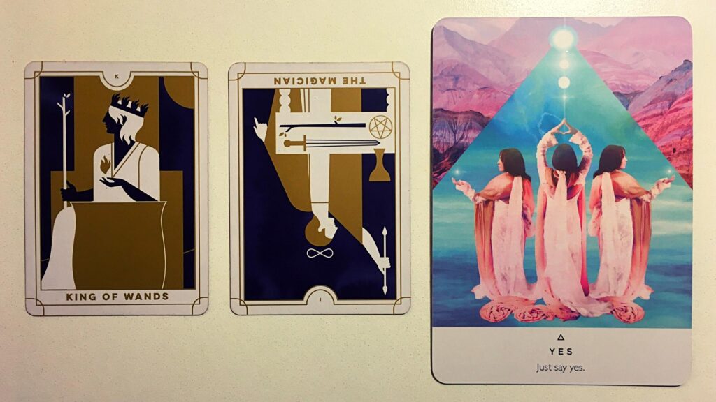 King of Wands and The Magician Reversed from the Everyday Tarot deck; the Yes card from the Work Your Light Oracle deck