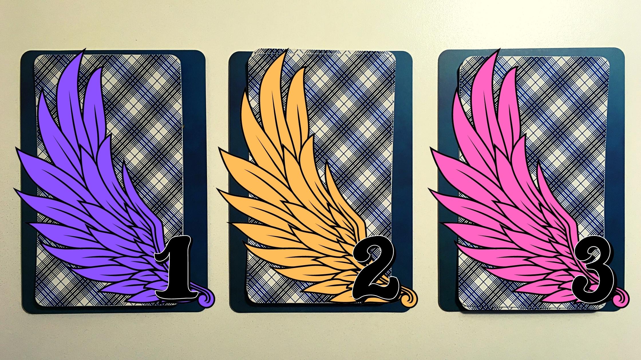 Three tarot and oracle pick a card piles with wings on them; Decks used include the Rider-Waite tarot and Angels and Ancestors Oracle deck