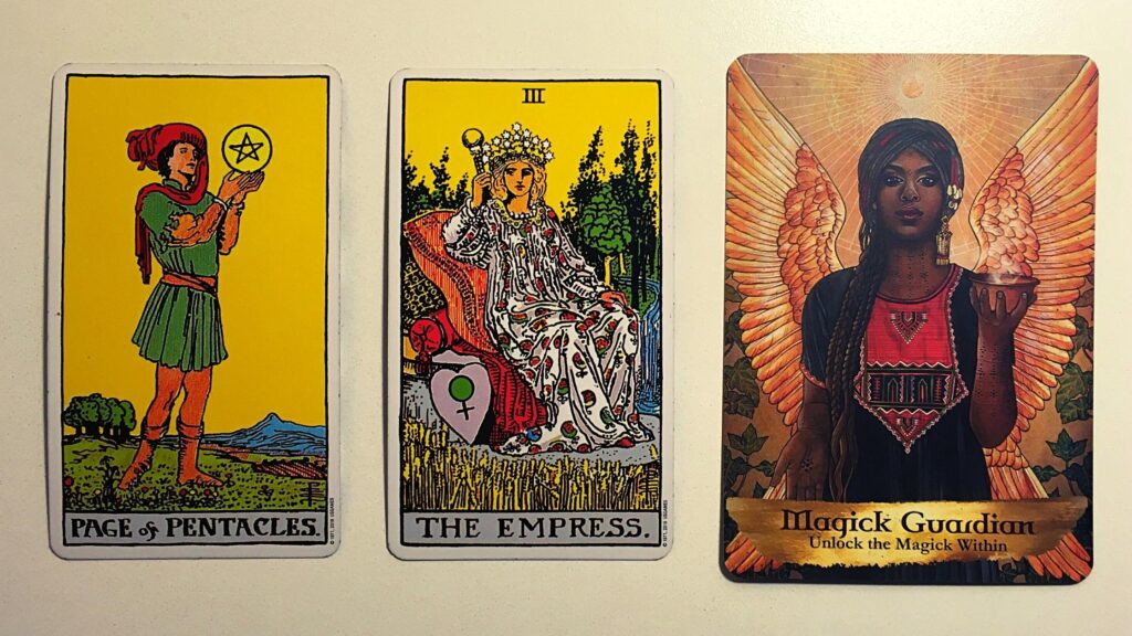 Page of Pentacles and The Empress from the Rider-Waite tarot deck; the Magick Guardian card from the Angels and Ancestors Oracle deck