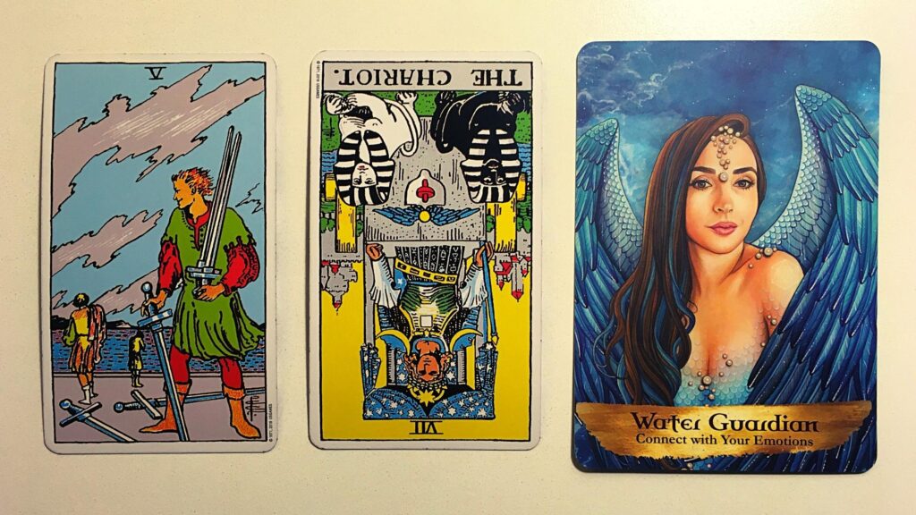 Five of swords and the Chariot reversed from the Rider-Waite tarot deck; the Water Guardian from the Angels and Ancestors oracle deck