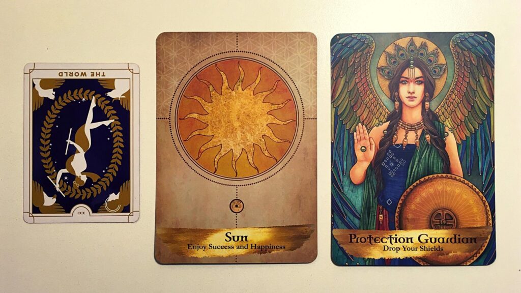 Tarot card and two oracle cards