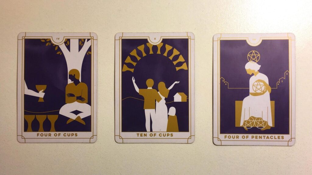 Four of Cups, Ten of Cups, and Four of Pentacles from the Everyday Tarot deck