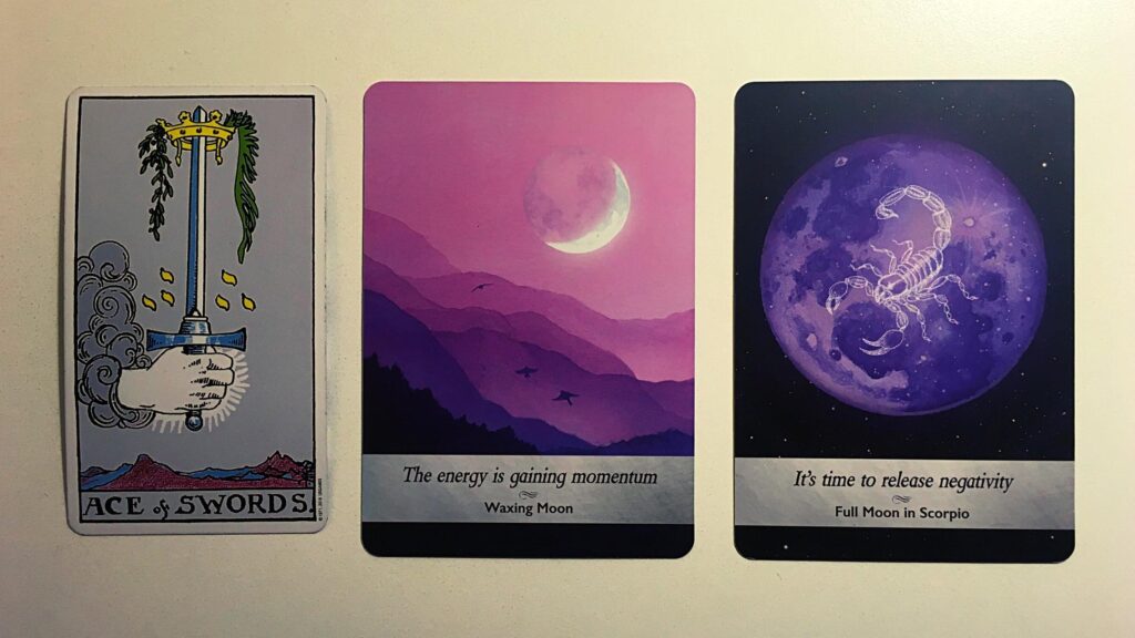 Ace of Swords from the Rider-Waite tarot deck; the Waxing Moon and Full Moon in Scorpio from the Moonology Oracle deck