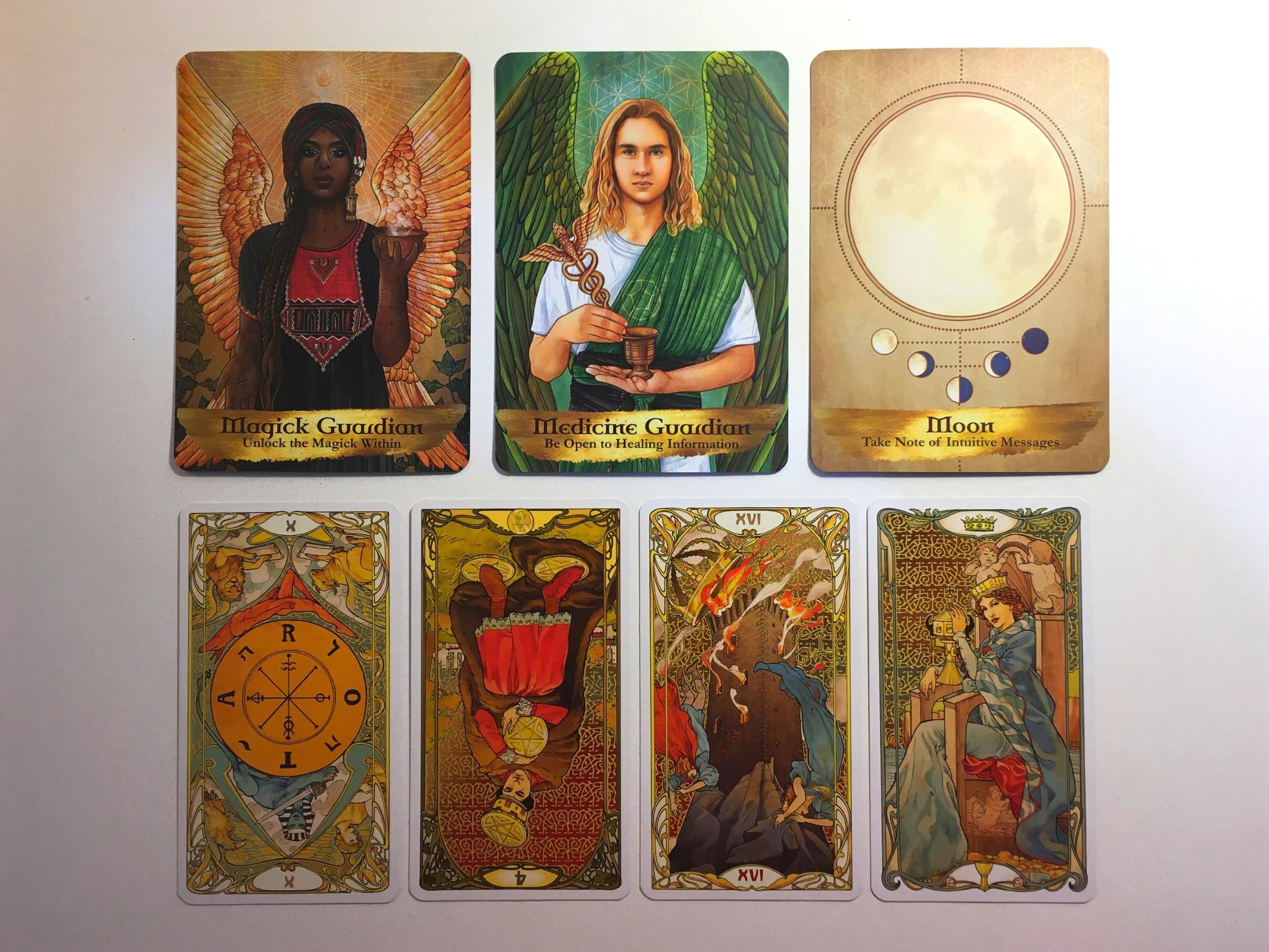 Three cards from the Angels and Ancestors Oracle deck and four cards from the Golden Art Nouveau Tarot deck