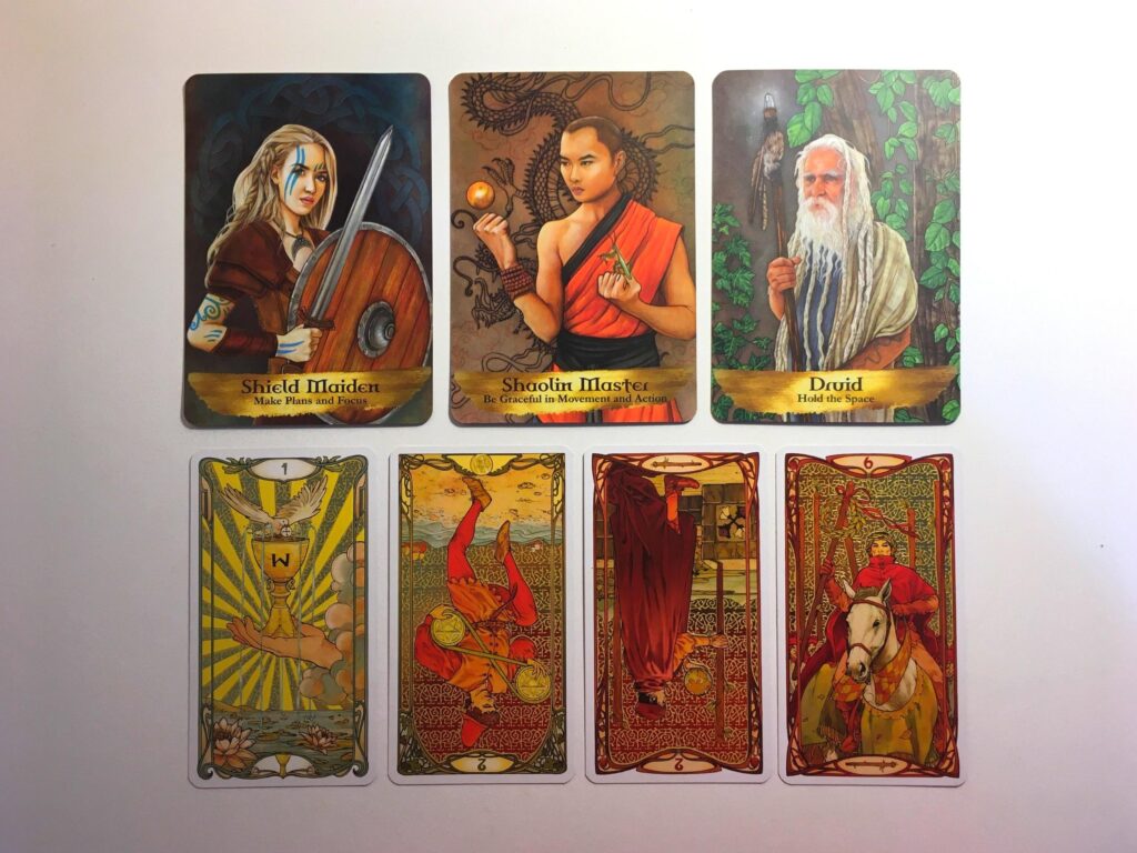 Three cards from the Angels and Ancestors Oracle deck and four cards from the Golden Art Nouveau Tarot deck