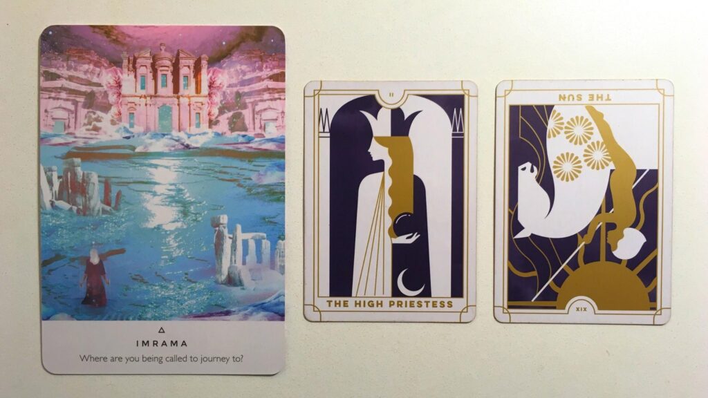 Imrama from the Work Your Light Oracle deck; the High Priestess and the Sun from the Everyday Tarot deck