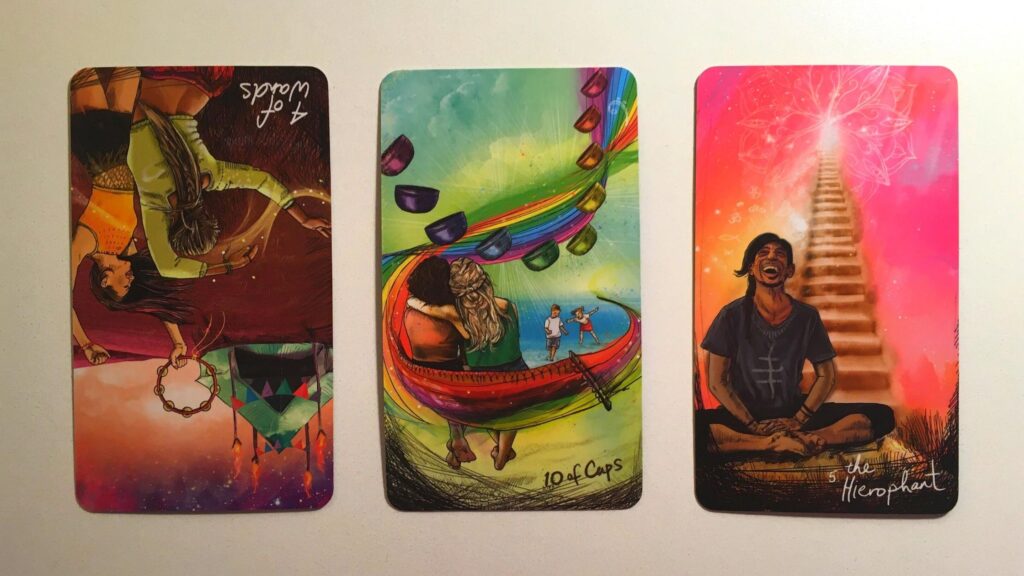 Four of Wands, Reversed, Ten of Cups, and The Hierophant from the Light Seer's tarot deck